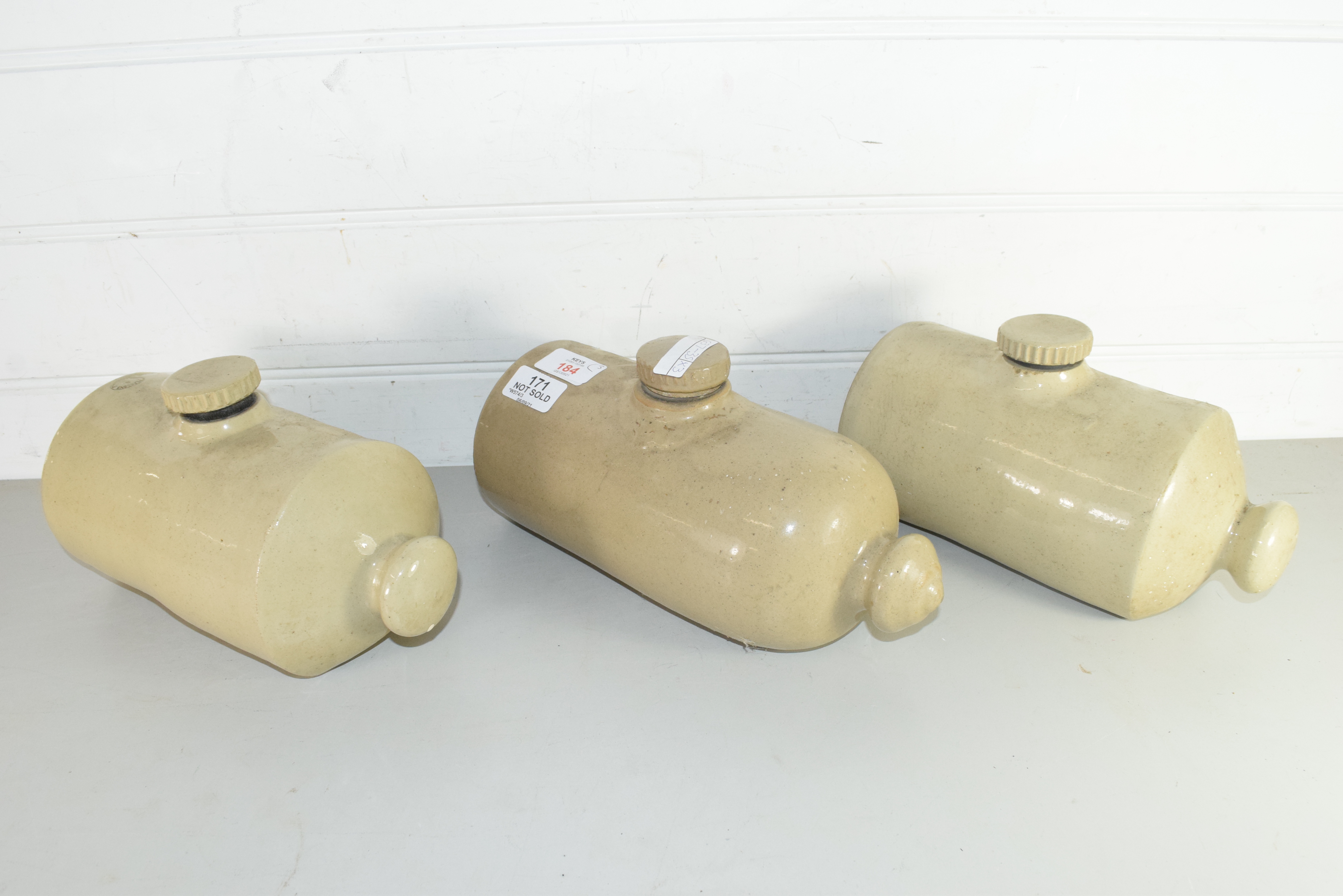 THREE STONEWARE HOT WATER BOTTLES