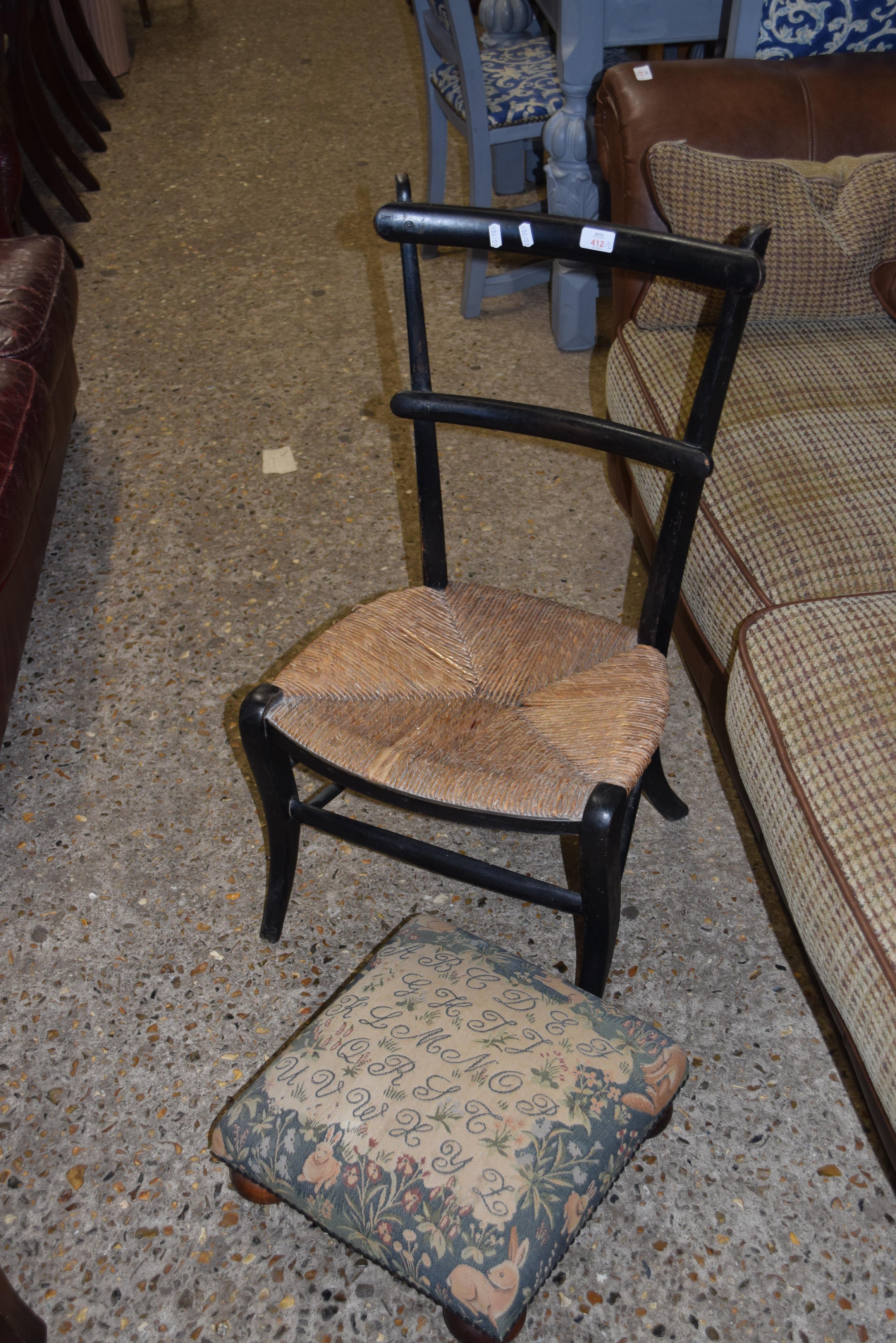 SINGLE RUSH SEATED CHAIR WITH EBONISED FRAMED AND A SMALL FLORAL UPHOLSTERED FOOT STOOL (2)