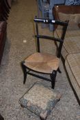 SINGLE RUSH SEATED CHAIR WITH EBONISED FRAMED AND A SMALL FLORAL UPHOLSTERED FOOT STOOL (2)