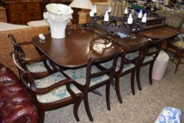 REPRODUCTION MAHOGANY PEDESTAL DINING TABLE WITH EXTRA LEAF TOGETHER WITH A SET OF EIGHT CHAIRS,