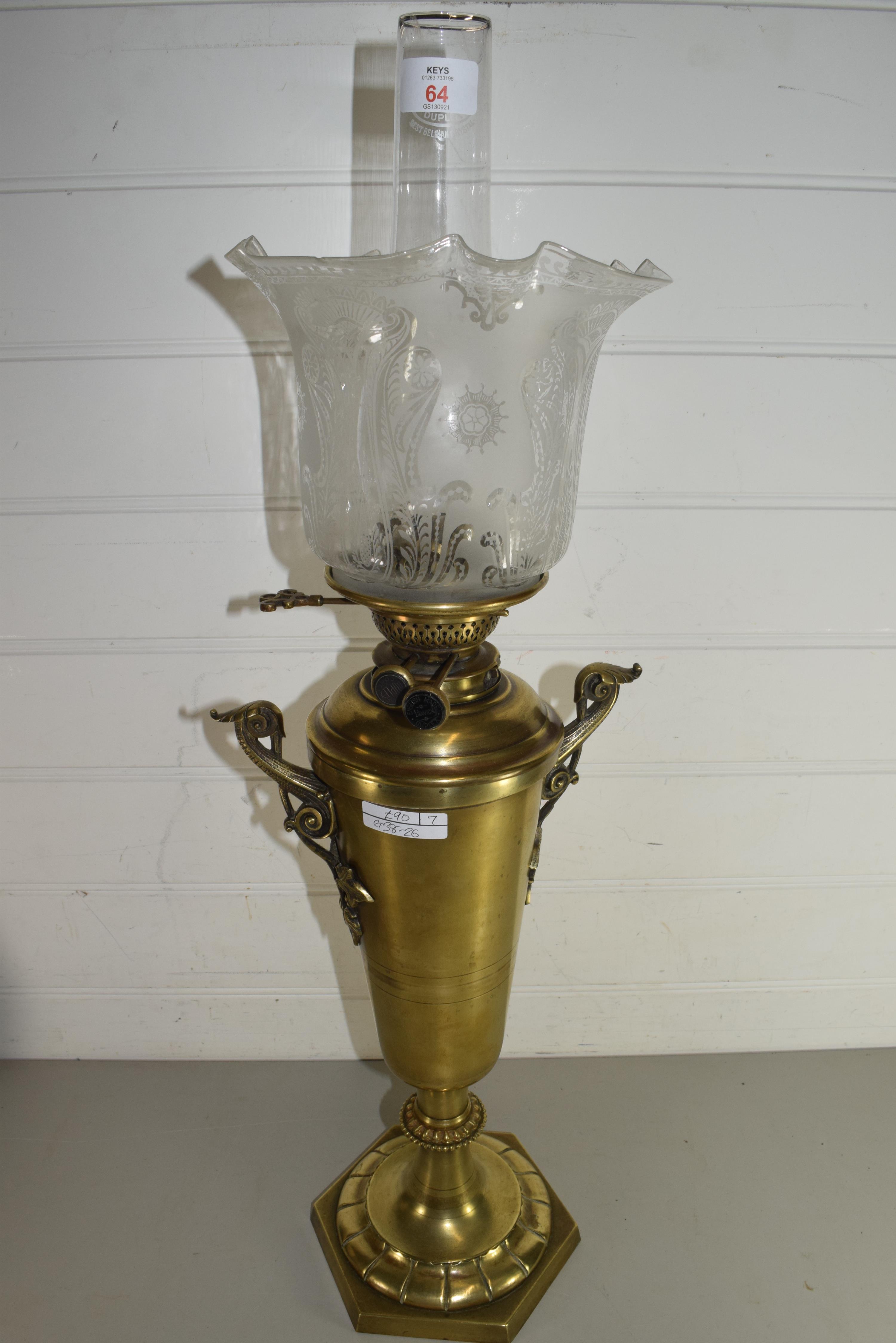 VICTORIAN OIL LAMP WITH FROSTED FLORAL DECORATED SHADE AND BRASS VASE FORMED BODY SET ON A HEXAGONAL