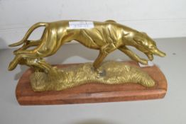 POLISHED BRASS MODEL OF A GREYHOUND ON HARDWOOD PLINTH BASE