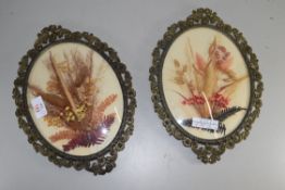 PAIR OF DRIED FLOWER AND FOLIAGE PICTURES IN OVAL PIERCED METAL FRAMES