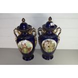 PAIR OF 20TH CENTURY BLUE AND GILT DECORATED VASES WITH INSET PANELS OF FASHIONABLE LADIES