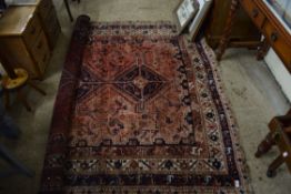 20TH CENTURY MIDDLE EASTERN WOOL FLOOR RUG DECORATED WITH GEOMETRIC PATTERNS AND STYLISED ANIMALS ON