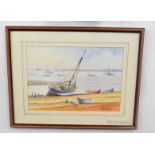 Kenneth Grant (British 20C), A sailboat and small craft beached . Watercolour, signed. Approx 8x10