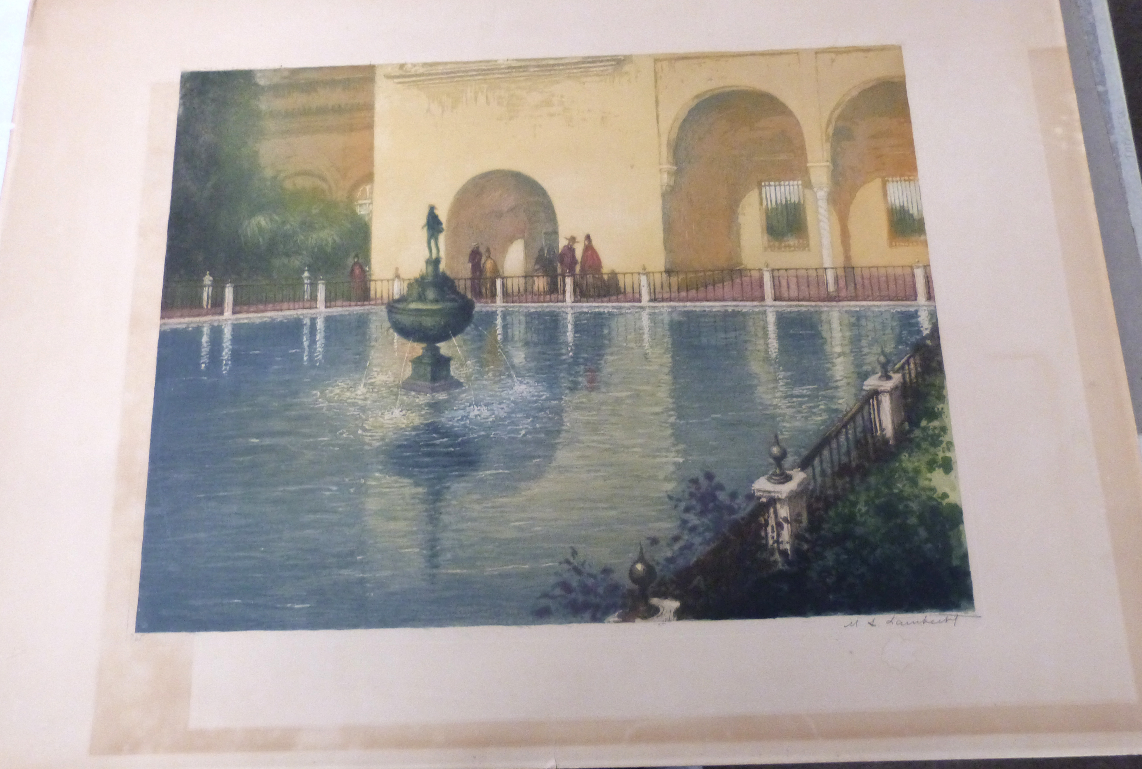 An early 20C Continental scene with figures next to a pool and fountain . Coloured lithograph,