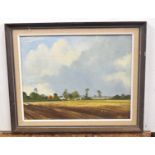 British 20C, A Norfolk landscape with a farmstead surrounding by cultivated fields . Oil on board,