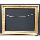 Gilt frame with running pattern. Approx 36-26 inches.