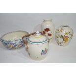 Group of Poole pottery including a bowl with floral design, two vases and a biscuit barrel