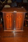 Late 19th century wall mounted mahogany smoker's cabinet with panelled doors decorated with Art