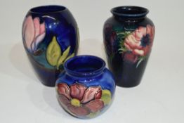 Group of three Moorcroft vases with tube lined floral designs