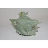 Green soapstone Chinese tea pot, modelled in relief with dragons and dragon finial, 9cm high