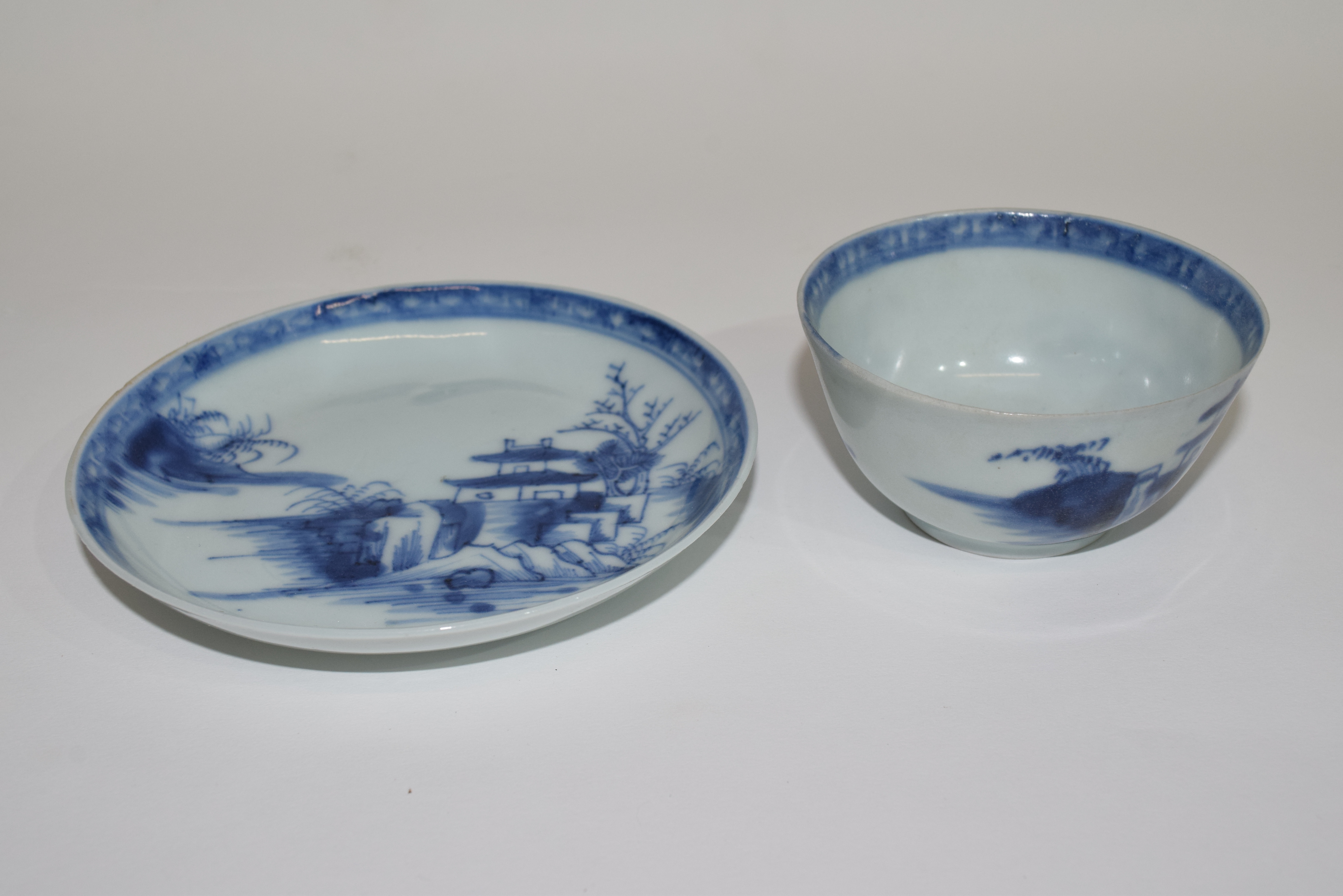 Nanking cargo blue and white tea bowl and saucer with sticker to base