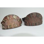 Pair of Victorian cast brass fireman's arm plaques dated 1881, semi-circular plaques mounted on