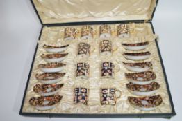 Cased Crown Derby coffee set comprising 10 coffee cans and 12 saucers