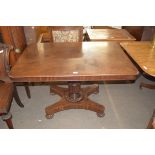 19th century mahogany pedestal dining table, the rectangular top over a turned column with four