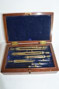 Mahogany cased drawing instruments, the hinged lid with lift up velvet padded compartment, beneath