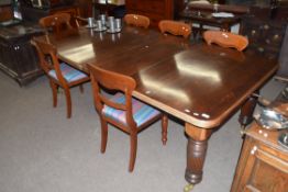 Late Victorian mahogany extending dining table raised on fluted legs and brass casters, 237cm wide