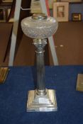 Late 19th century oil lamp, clear glass font, raised on a silver plated Corinthian column and a