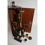 W Watson & Sons, High Holborn, London, Praxis microscope finished in black and brass lacquer, approx