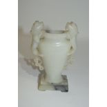 Chinese soapstone vase of flattened shape, flanked by two Chinese dragons, on rectangular base, with