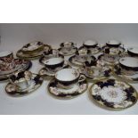 Part Coalport tea service with a floral design on gilt and blue ground comprising 12 cups,