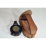 Cooke Troughton & Simms compass in leather case, likely early 20th century manufacture, possibly