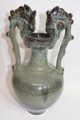 Large high-fired Oriental bowl with handles shaped as dragons, 33cm high
