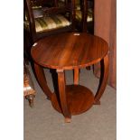 Early 20th century rosewood two-tier occasional table in the Art Deco style, the circular top