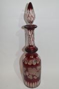 Bohemian style glass decanter and tear drop stopper, the decanter with a design of fruiting vine and