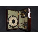 Primitive crystal radio set in a simulated rosewood case of hinged rectangular form, 18cm wide, no