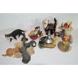 Group of ceramic sculptures including various models of cats and Royal Doulton Rupert the Bear (