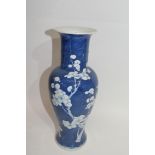 Chinese porcelain vase of baluster shape, the blue ground decorated with prunus with Chinese marks