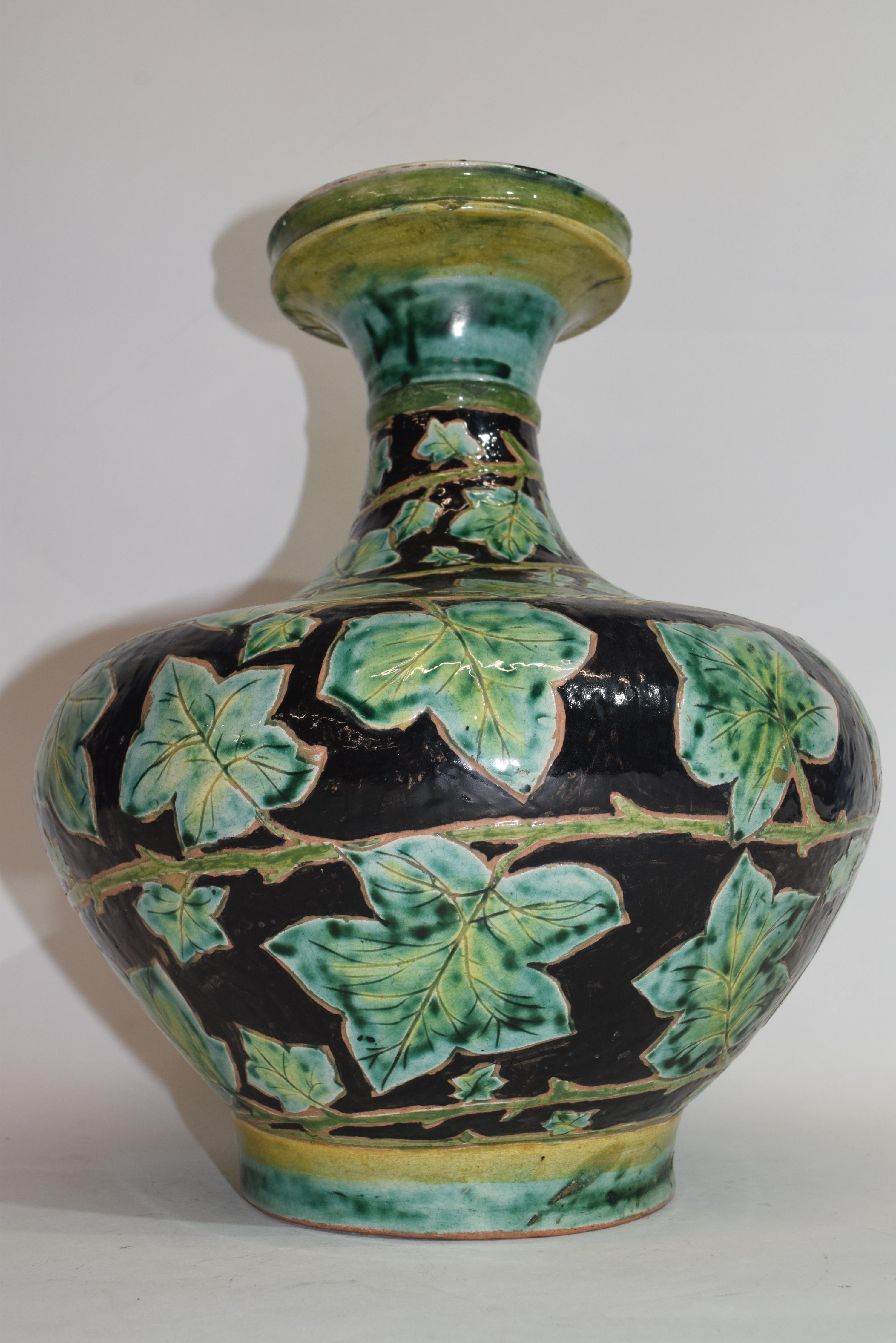 Della Robbia pottery vase, the brown ground with a green leaf decoration, factory mark to base - Image 2 of 2