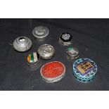 Collection of sterling silver and white metal pill boxes to include a Jordanian enamelled example,