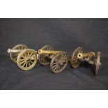 Group of three 20th century cast metal models of cannons, approx 10cm high (3)