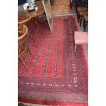 Large 20th century Bokhara type carpet with a large central panel decorated with medallions,