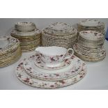 An extensive dinner service by Minton in the Ancestral pattern comprising several hundred pieces