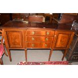 Edwardian mahogany sideboard with three drawers fitted with brass ringlet handles and two panelled
