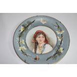 Victorian plate with a hand painted decoration of a young gipsy girl, signed verso