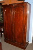 Victorian mahogany linen press cabinet with two large panelled doors opening to an interior with