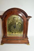 Edwardian mantel clock of large proportions with unsigned arched brass dial decorated with pierced