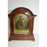 Edwardian mantel clock of large proportions with unsigned arched brass dial decorated with pierced