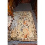 20th century Middle Eastern wool floor rug decorated with a scene of figures on horseback, 164 x