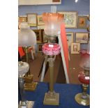 Victorian oil lamp with tinted frosted glass shade, clear glass chimney, opaque pink glass font with