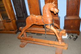 20th century stained pine rocking horse, 109cm high