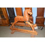20th century stained pine rocking horse, 109cm high