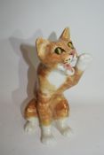 Winstanley type model of a cat with glass eyes, indistinctly signed to base