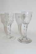 Two cordial glasses with faceted stems, one with shaped foot, one with engravings of flowers (2),